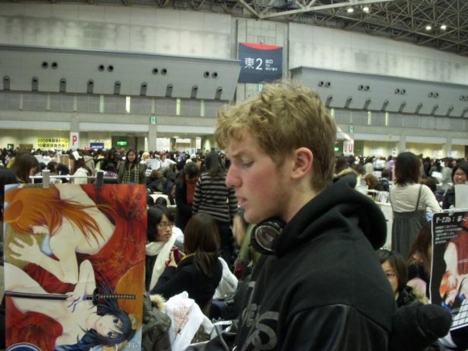 A foreign attendee stands in awe at some work of art